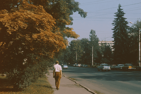 Man Walking Under Autumn Trees: vintage, street — AI-generated Photorealistic image made with Midjourney