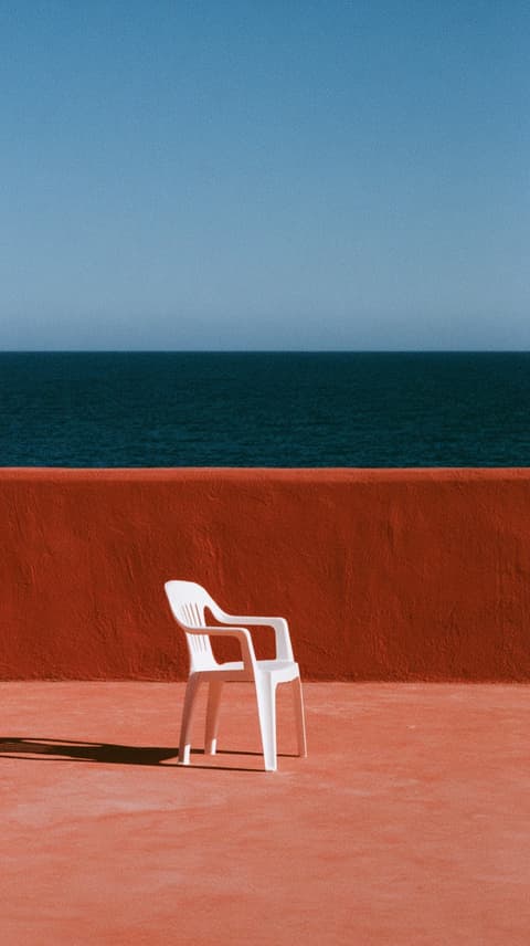 White Chair Facing the Sea: architecture, chair — AI-generated Architecture image made with Midjourney