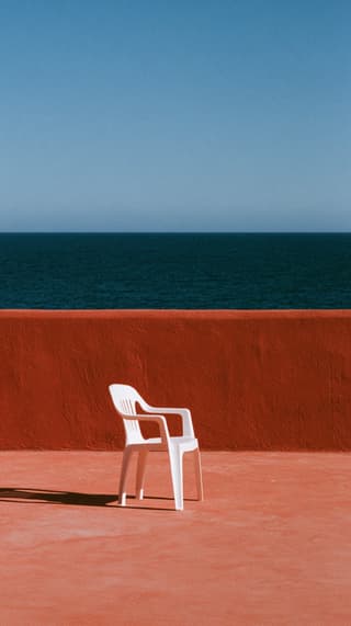 White Chair Facing the Sea: architecture, chair — AI-generated Architecture image made with Midjourney